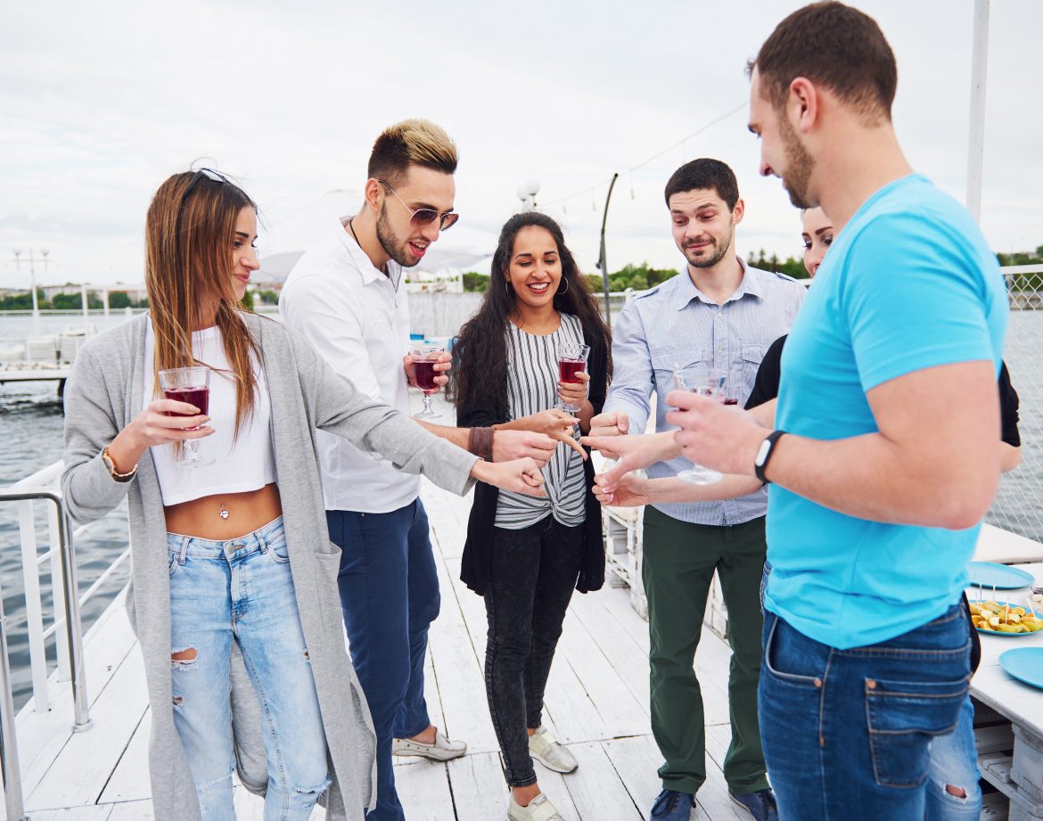 Friends congratulate his friend on his birthday.